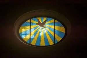 Stained glass window in a cathedral, representing the Holy Spirit